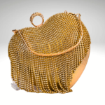 Heart of Gold: Golden Purse with Romantic Heart-Shaped Clutch Work | Surbhi's Couture