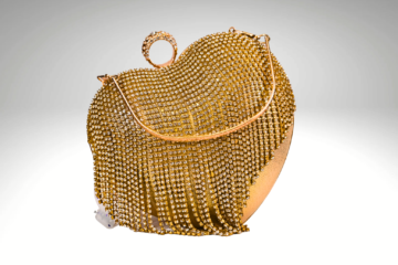 Heart of Gold: Golden Purse with Romantic Heart-Shaped Clutch Work | Surbhi's Couture